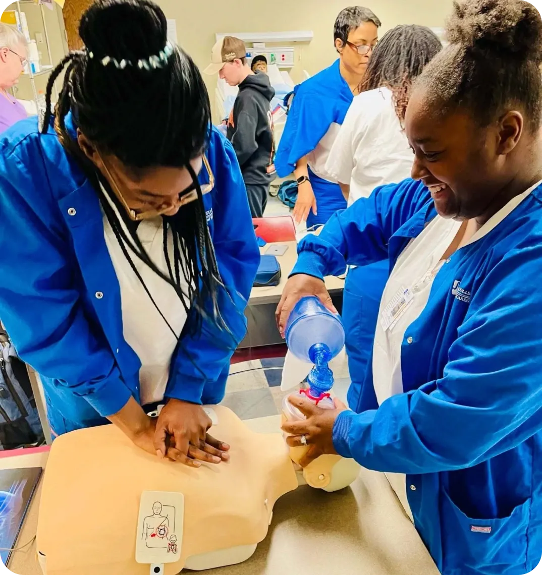 Healthcare students practicing clinical skills with an instructor in a simulation lab