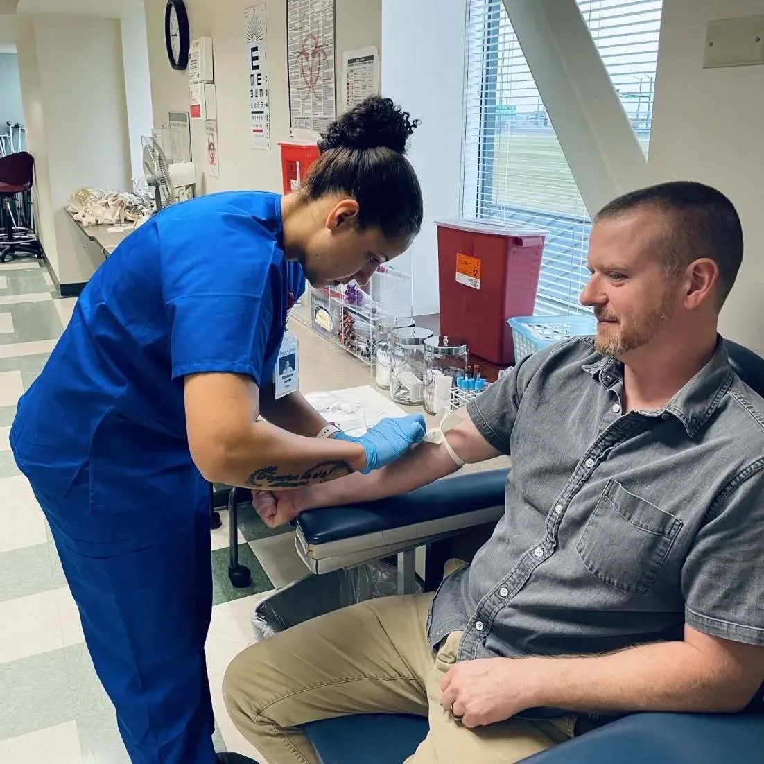 A practical nursing student practising clinical skills in a lab