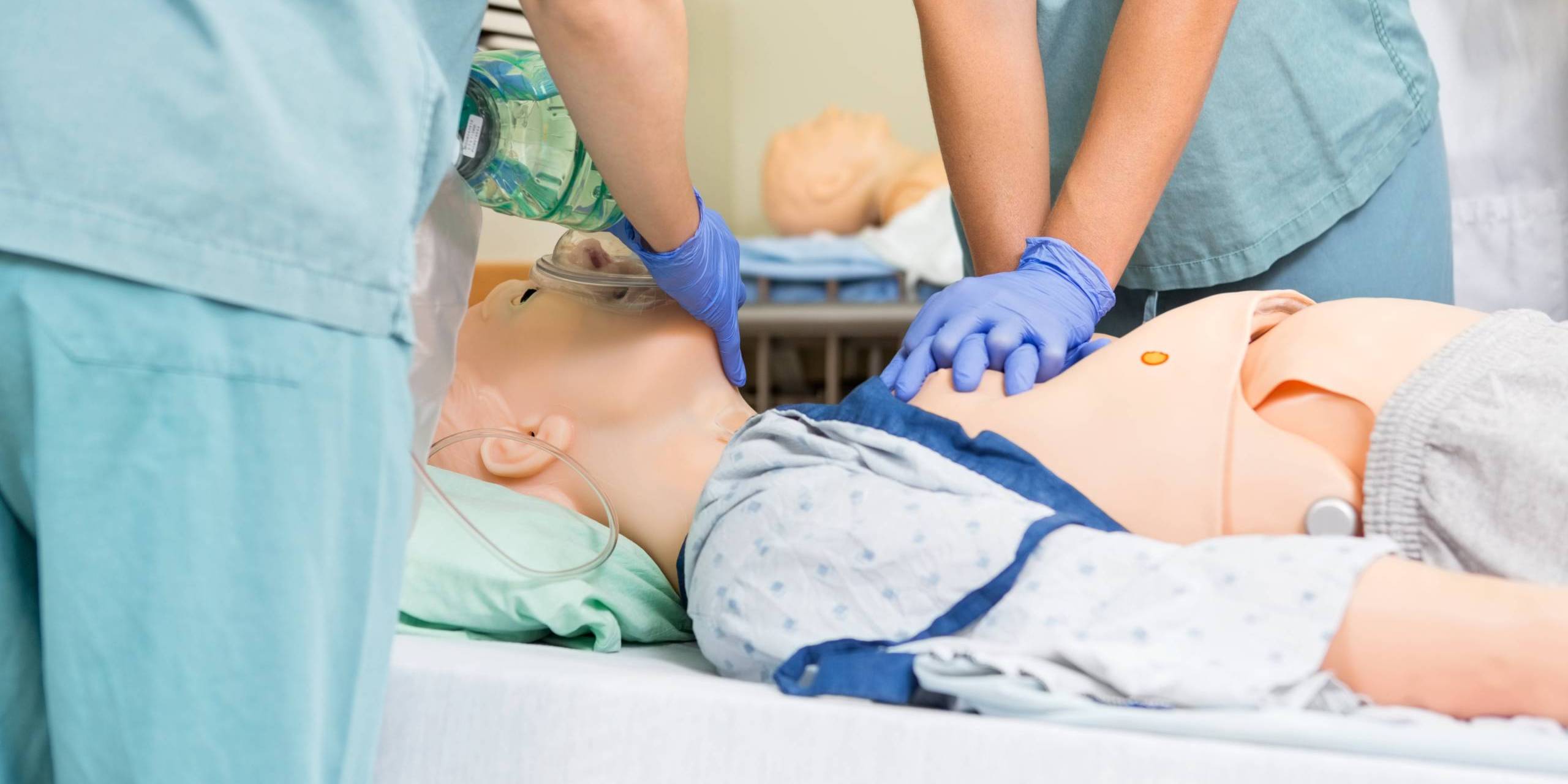 nursing students using a simulation lab