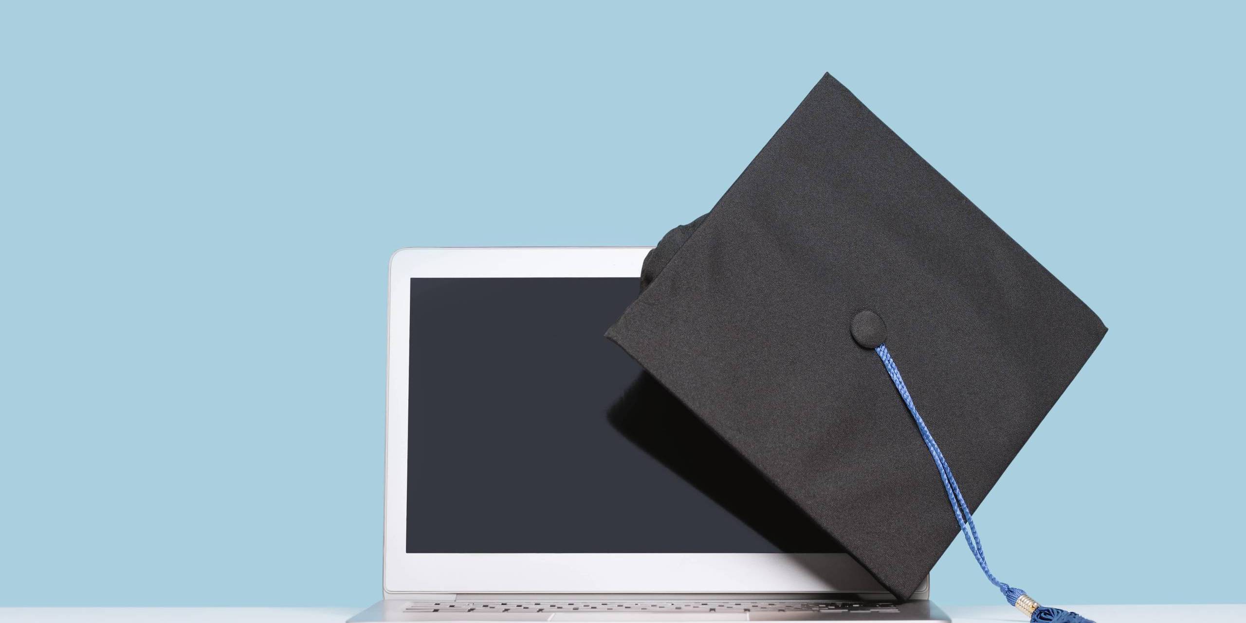 college cap and laptop-min college cap and laptop computer