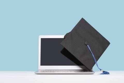 college cap and laptop-min college cap and laptop computer