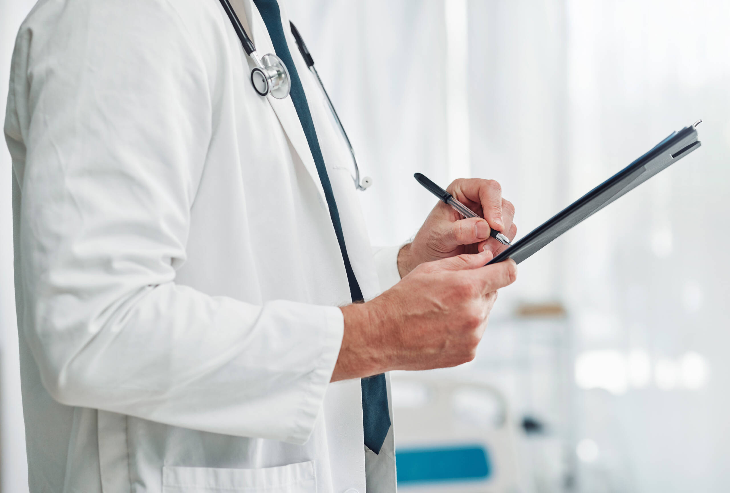 Doctor, clipboard or hands writing checklist for healthcare consulting, medical information or prescription. Nurse, medicine or worker with documents, wellness report planning or paper administration healthcare administrators