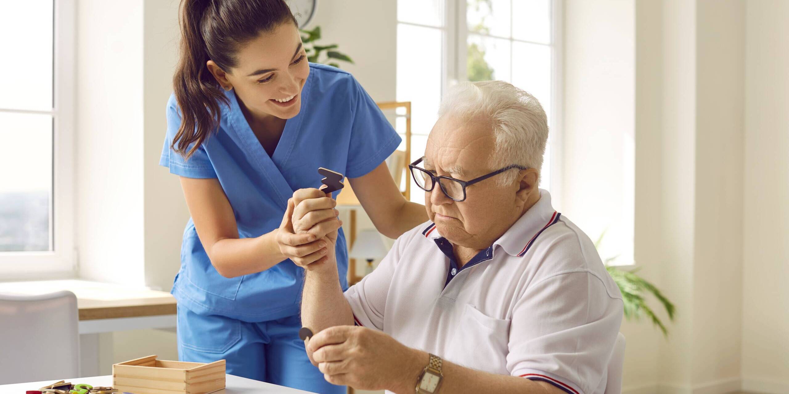 geriatric care professional is assisting an elderly patient in St. Louis