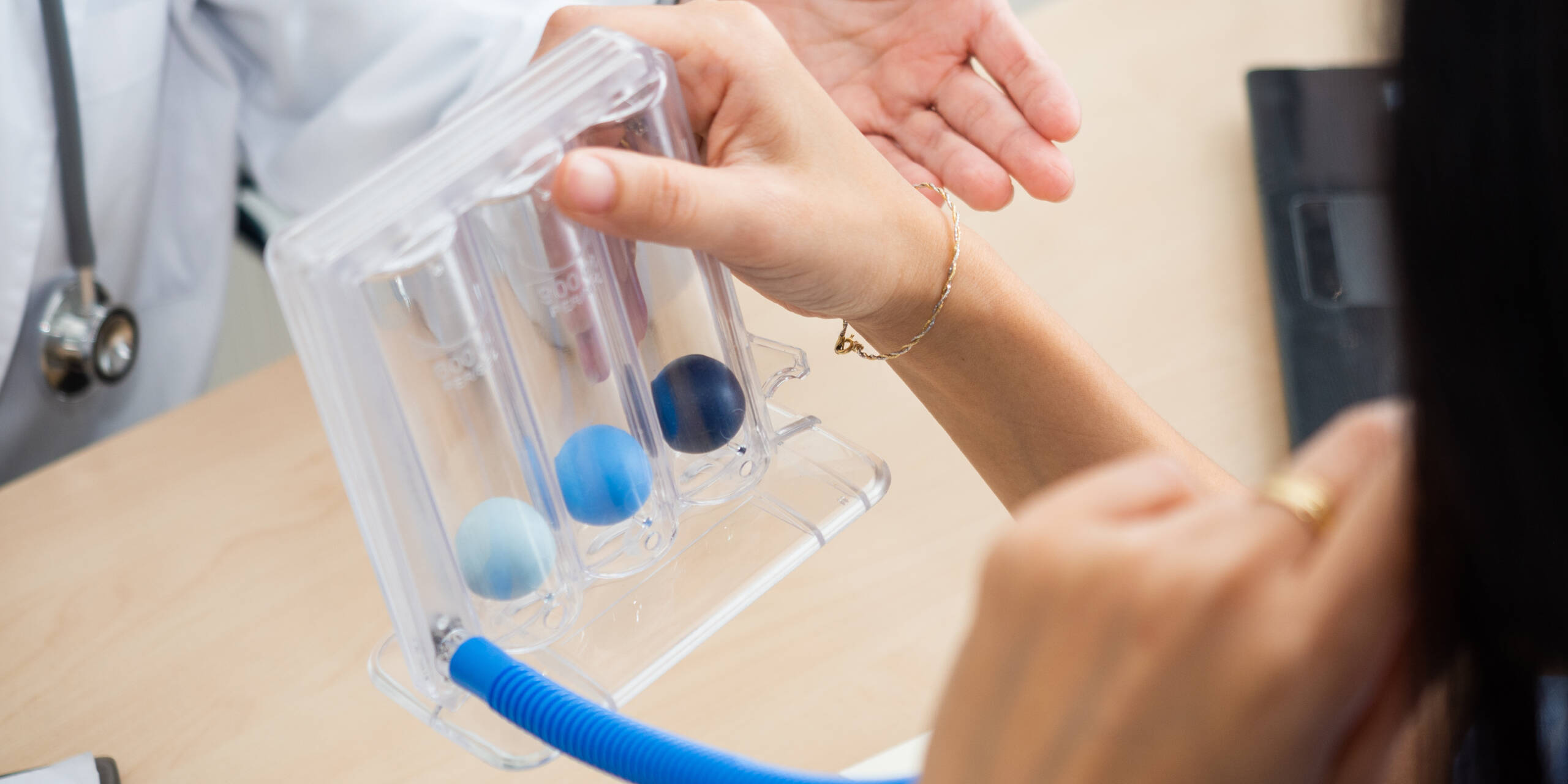 Post-Lung Surgery Care a patient is using a post op lung breathing device