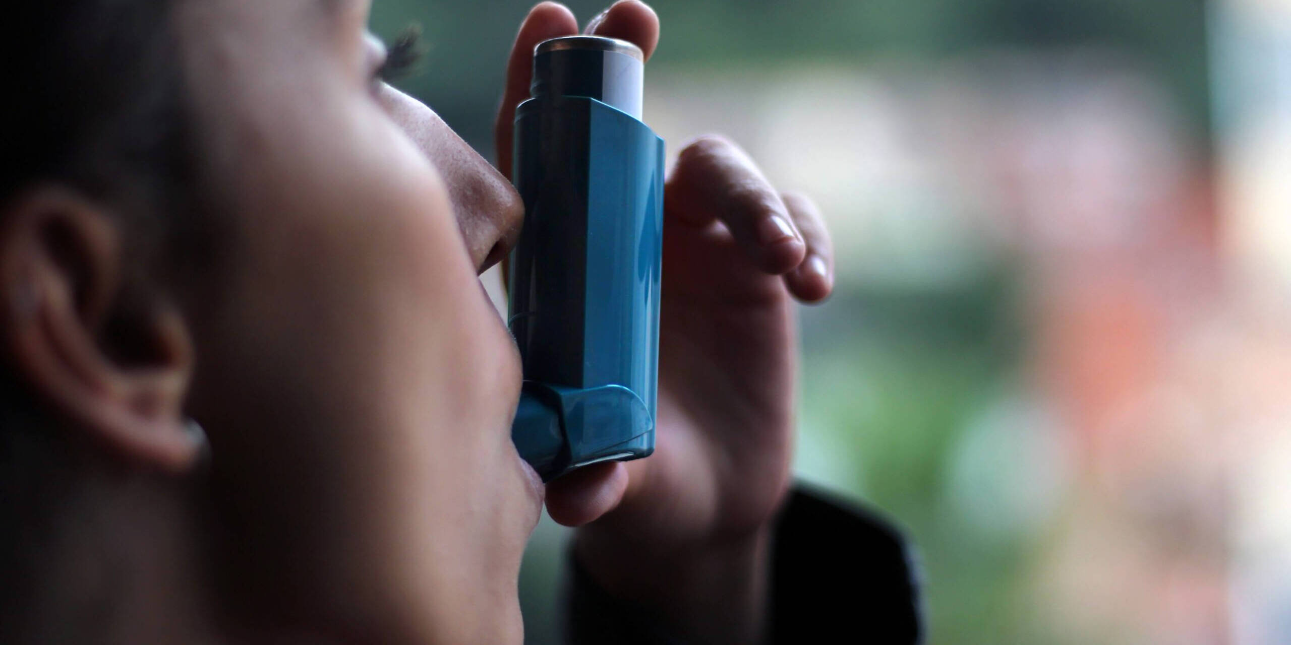 Inhaler Techniques person using inhaler