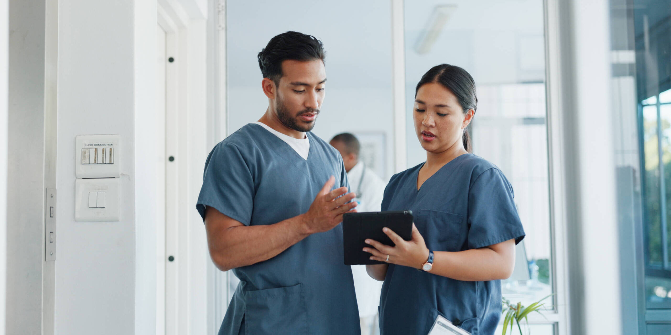 nurses lead talking to team member