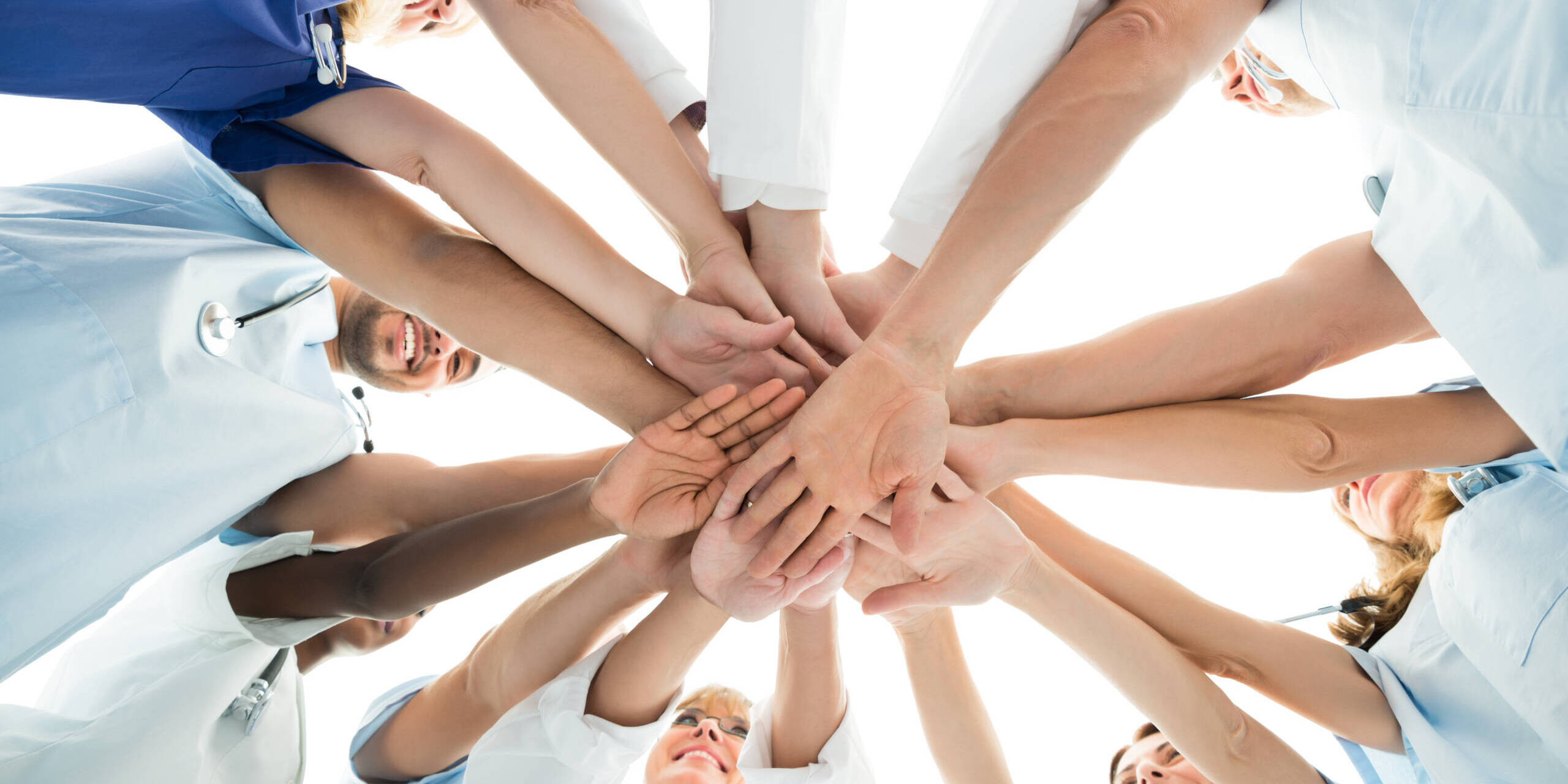 Multiethnic Medical Team Stacking Hands teamwork in nursing